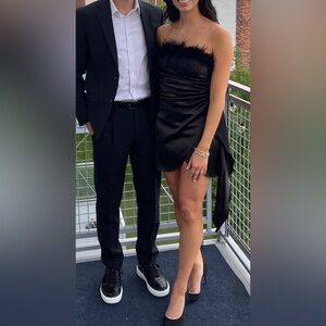 Black satin strapless mini dresss with feathers